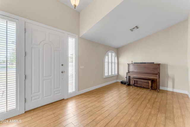 foyer entrance featuring light wood-type flooring and plenty of natural light