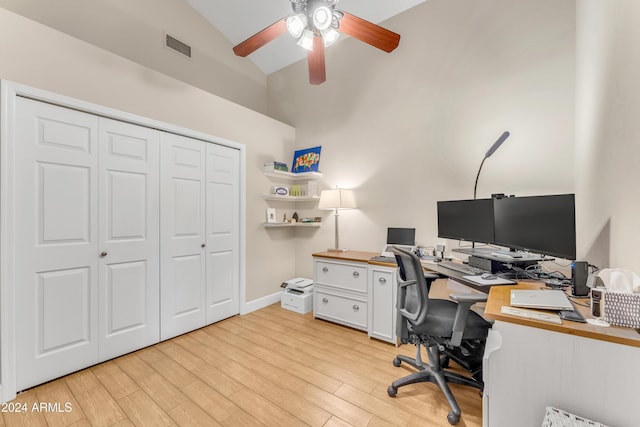 office space featuring ceiling fan, light hardwood / wood-style floors, and lofted ceiling