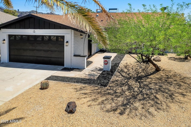 811 E Brown St, Phoenix, AZ 85020 - view of side of property featuring brick siding, driveway, an attached garage, and a shingled roof