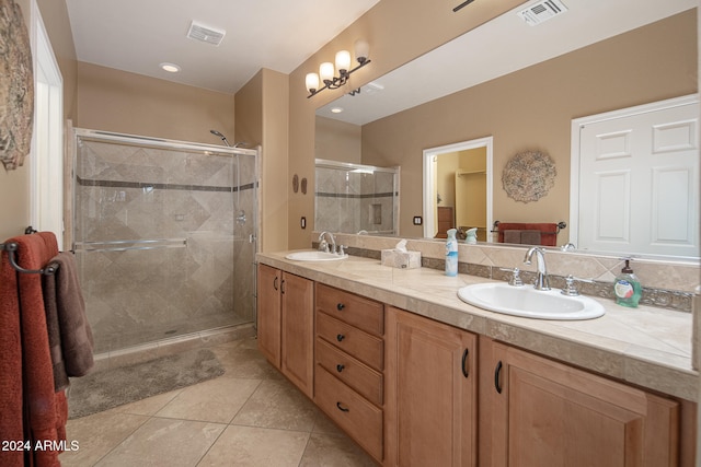 bathroom with vanity, tile patterned floors, and walk in shower