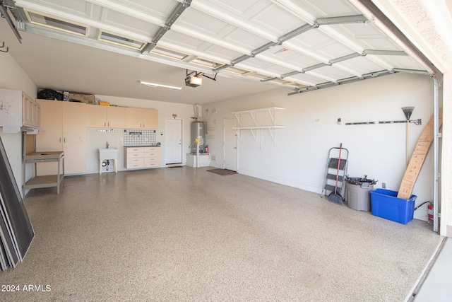 garage with sink, a garage door opener, and water heater