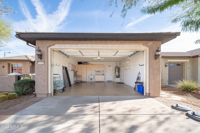 garage with water heater and a garage door opener