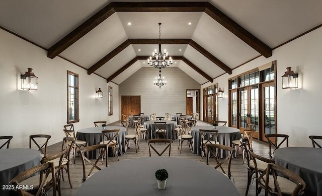 dining area with beam ceiling, recessed lighting, an inviting chandelier, wood finished floors, and high vaulted ceiling