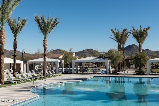 view of swimming pool featuring a gazebo and a mountain view