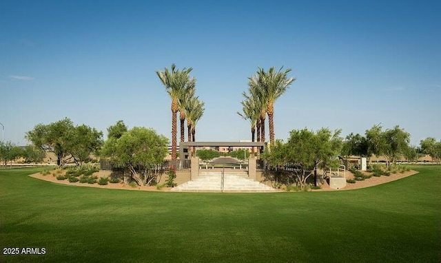 view of home's community with a yard