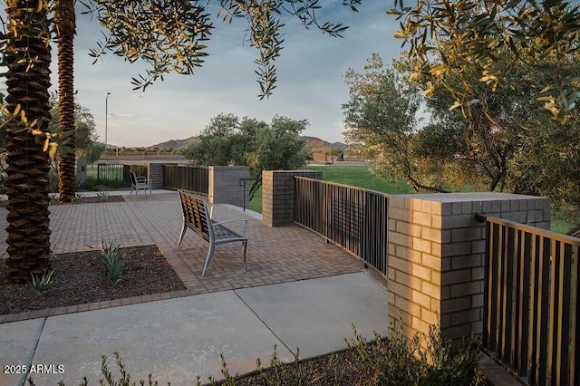 view of patio / terrace featuring fence