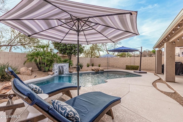 view of swimming pool with a patio area, a fenced in pool, and a fenced backyard