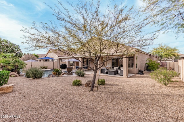 rear view of house featuring a fenced backyard, central AC unit, stucco siding, and a patio