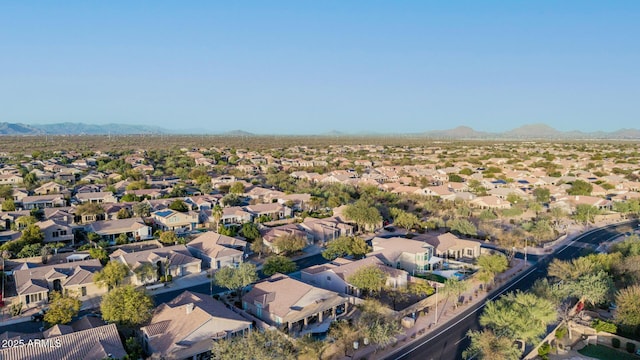 birds eye view of property featuring a mountain view and a residential view