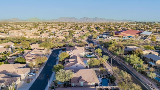 drone / aerial view featuring a residential view and a mountain view