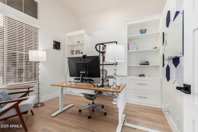 office featuring baseboards and wood tiled floor