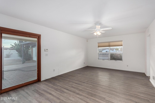 empty room with ceiling fan and hardwood / wood-style floors