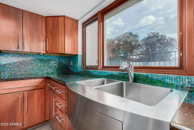 kitchen featuring sink and tasteful backsplash