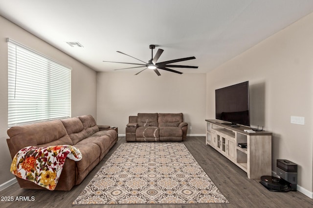 living room featuring dark hardwood / wood-style floors and ceiling fan