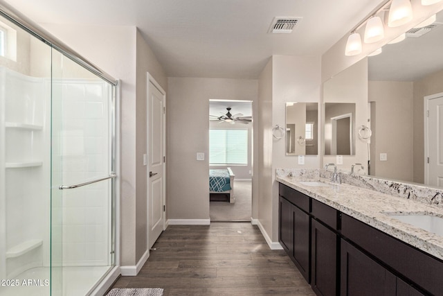 bathroom featuring vanity, hardwood / wood-style floors, ceiling fan, and walk in shower