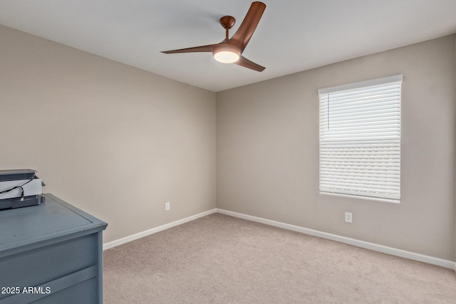 interior space featuring ceiling fan and light carpet