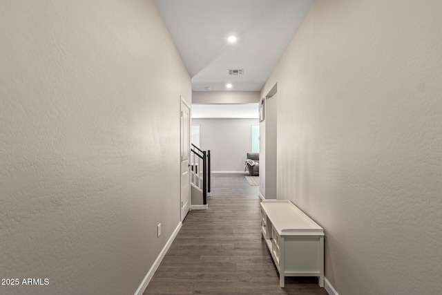 hallway with dark hardwood / wood-style flooring