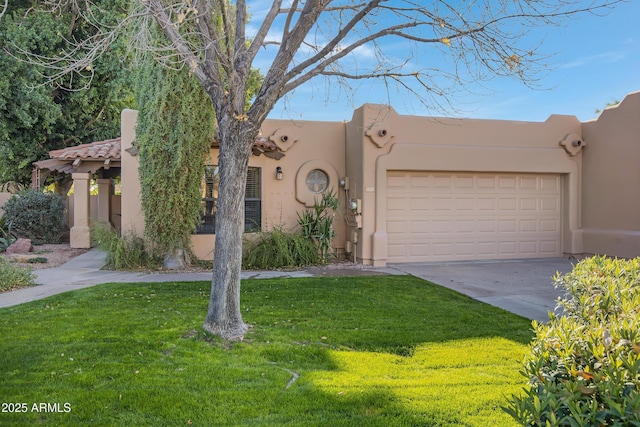 adobe home featuring a garage and a front lawn