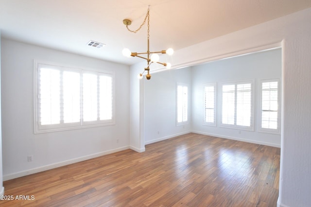 20258 S 196th St, Queen Creek, AZ 85142 - empty room with a chandelier and wood finished floors