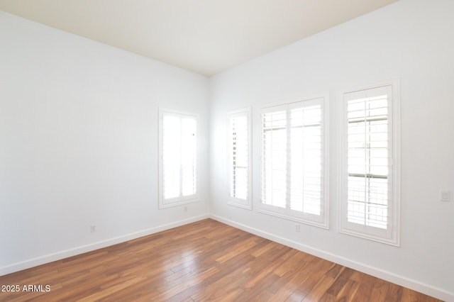 20258 S 196th St, Queen Creek, AZ 85142 - spare room featuring baseboards and wood finished floors