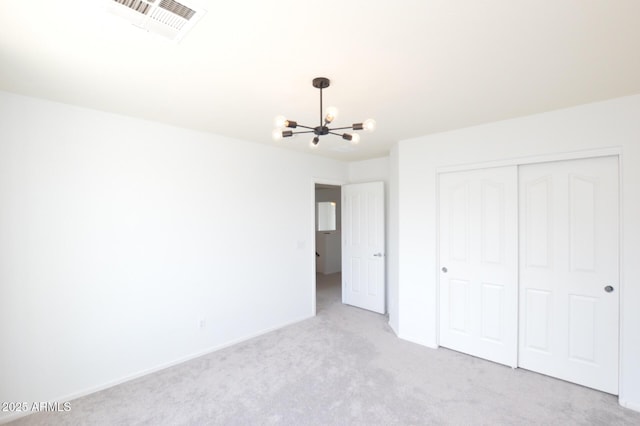 20258 S 196th St, Queen Creek, AZ 85142 - unfurnished bedroom featuring a chandelier, carpet, and a closet