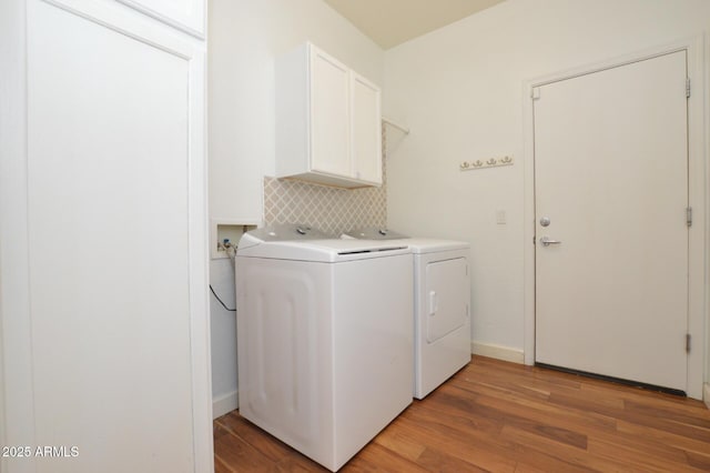 20258 S 196th St, Queen Creek, AZ 85142 - laundry area featuring cabinet space, washing machine and clothes dryer, and light wood-style flooring