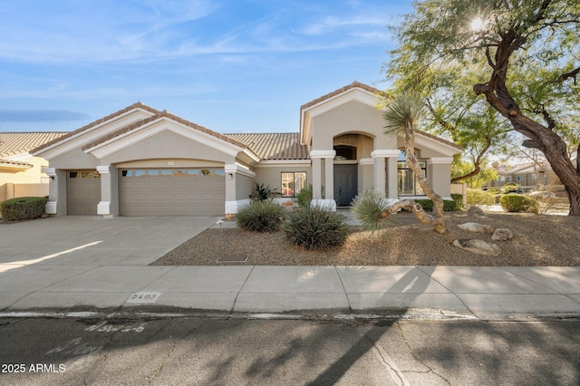 mediterranean / spanish-style home featuring a garage