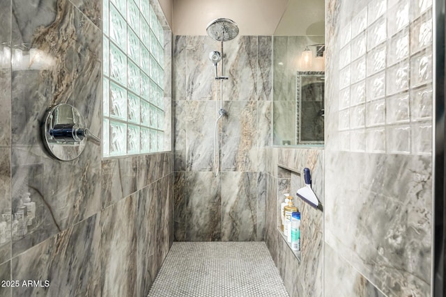 full bath featuring a tile shower