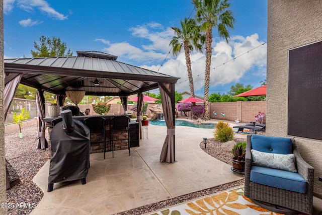 view of patio / terrace featuring a gazebo, a fenced backyard, and a grill