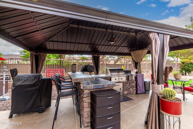 view of patio featuring a gazebo, grilling area, area for grilling, and fence