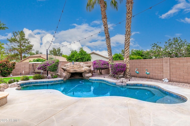 view of pool with a fenced backyard and a patio