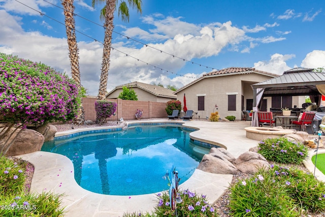 view of pool featuring a gazebo, a patio, and a fenced backyard