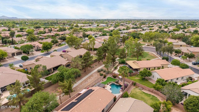 aerial perspective of suburban area featuring a pool