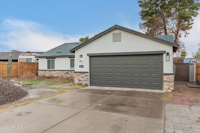 ranch-style house featuring stone siding, fence, and stucco siding