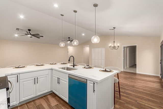 kitchen featuring visible vents, dishwasher, lofted ceiling, dark wood-style flooring, and a sink