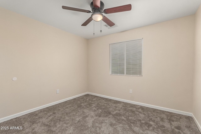 carpeted empty room with visible vents, a ceiling fan, and baseboards