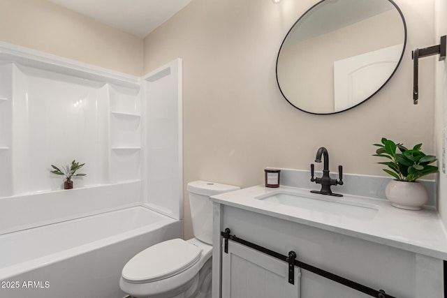 bathroom with toilet, shower / washtub combination, and vanity