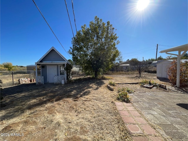 view of yard with a patio area and a shed