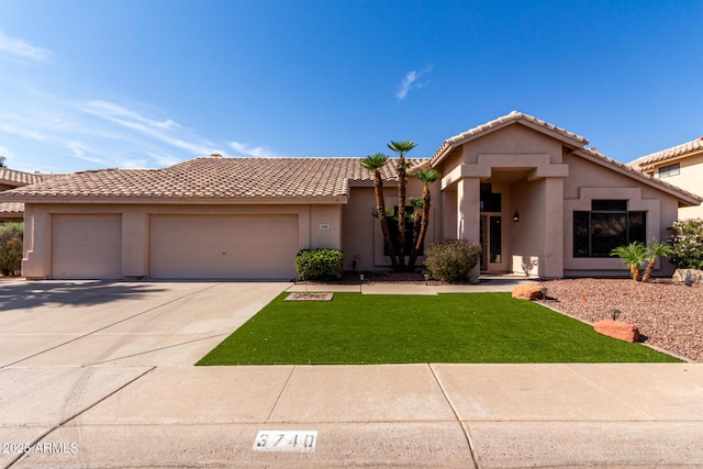 3740 W Kent Dr, Chandler, AZ 85226 - view of front of property featuring a garage, stucco siding, driveway, a front lawn, and a tiled roof