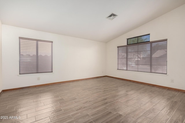 3740 W Kent Dr, Chandler, AZ 85226 - spare room featuring lofted ceiling, wood finished floors, and baseboards