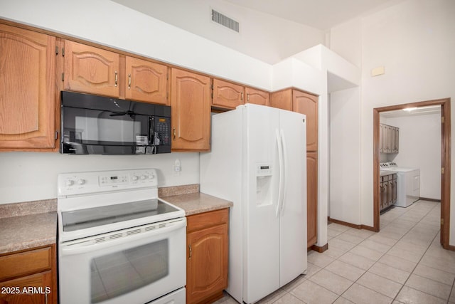 3740 W Kent Dr, Chandler, AZ 85226 - kitchen with white appliances, independent washer and dryer, light tile patterned flooring, and light countertops