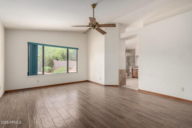 3740 W Kent Dr, Chandler, AZ 85226 - unfurnished room featuring vaulted ceiling, ceiling fan, wood finished floors, and baseboards