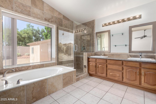3740 W Kent Dr, Chandler, AZ 85226 - bathroom with a bath, a shower stall, double vanity, tile patterned floors, and a ceiling fan