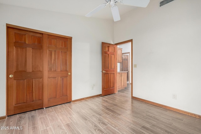 3740 W Kent Dr, Chandler, AZ 85226 - unfurnished bedroom with light wood-type flooring, baseboards, and a ceiling fan