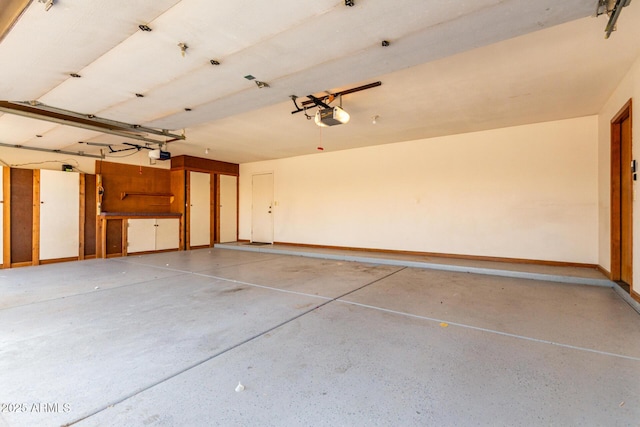 3740 W Kent Dr, Chandler, AZ 85226 - garage featuring a garage door opener and baseboards