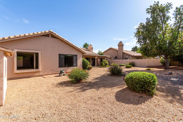 3740 W Kent Dr, Chandler, AZ 85226 - back of property featuring stucco siding, a chimney, and a tiled roof