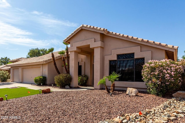 3740 W Kent Dr, Chandler, AZ 85226 - view of front of house featuring a garage, a tile roof, concrete driveway, and stucco siding