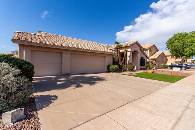 3740 W Kent Dr, Chandler, AZ 85226 - mediterranean / spanish house with an attached garage, stucco siding, concrete driveway, and a tiled roof