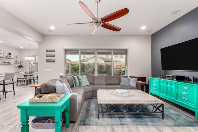 living room with ceiling fan, wood finished floors, and recessed lighting