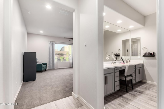 full bath featuring double vanity, recessed lighting, visible vents, and baseboards